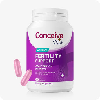 For Conceive Plus Women's Fertility Support and Fertility Lubricant Bundle, featuring a large white bottle with bold purple labeling for 60-count vegan prenatal capsules, shown with two pink capsules placed in front to highlight dosage form and branding against white background.